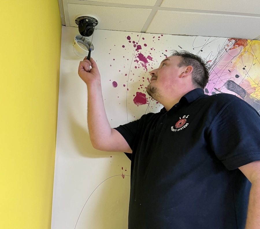 IDS installer setting up a new office security system
