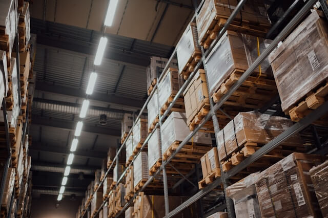 Security systems for warehouses - photo of a warehouse with lots of boxes on shelves